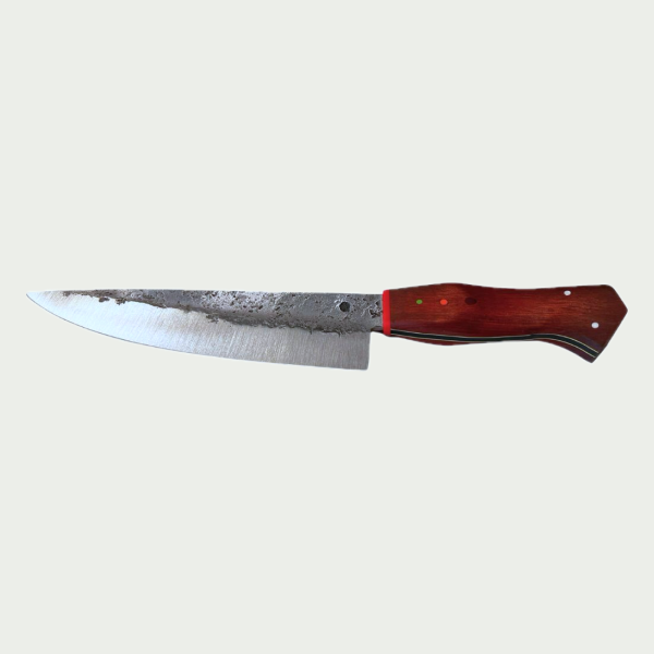 Chef's knife, hand-forged A hand-forged chef's knife with a satin-ground edge, forge finish along the spine and a red hardwood handle with three pins